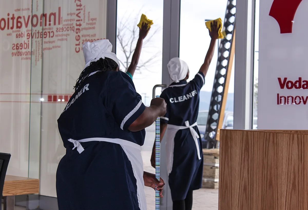Cleaning professional making a workspace clean and ready